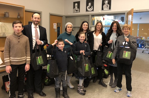 photo - Several VHA students and teachers delivered the mishloach manot bags to the Jewish Food Bank on Feb. 22