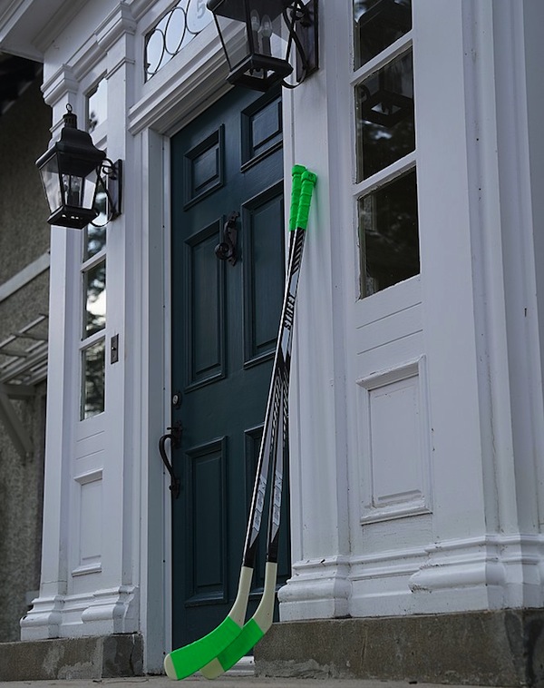 photo - Many Canadian residents are leaving their hockey sticks outside their homes in solidarity with the Humboldt Broncos