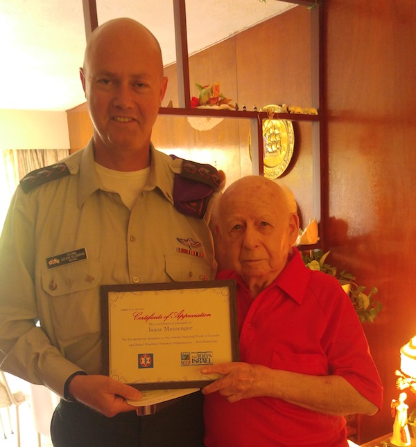 photo - Isaac Messinger being presented with a certificate of appreciation last year for his contributions to the Jewish National Fund of Canada and Beit Halochem