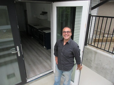 photo - Avie Estrin outside of Yaffa’s new laneway house