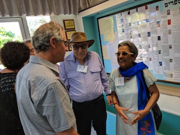 photo - Aliza and Joe Ziv, who now live in Israel, speak with Vancouver dentist Dr. Brian Goldenberg. Aliza Ziv was Goldenberg’s Grade 1 teacher at Vancouver Talmud Torah