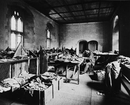 photo - Solomon Schechter at work in the old Cambridge University Library, with the crates of material from the Cairo geniza around him