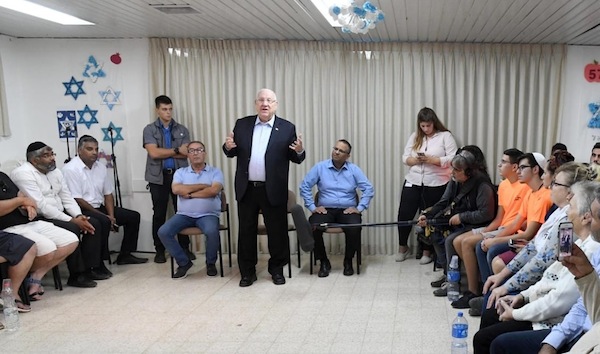 photo - Israeli President Reuven Rivlin addresses a group of local residents in a protected space in the northern Negev city of Netivot on Nov. 13