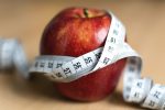 photo - apple with measuring tape