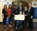photo - Left to right are Louis Brier Home and Hospital staff Jennifer Belen, Nicole Encarnacion, Carol Bucknor, David Keselman (chief executive officer) and Rozanne Kipnes with MLA George Heyman and Louis Brier resident Roberta Gilmore (holding the cheque)