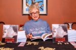 photo - Janet Wees at a book signing for her novel When We Were Shadows, which she’ll be bringing to the Cherie Smith JCC Jewish Book Festival on Feb. 10