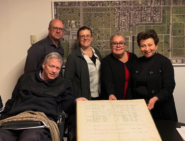 photo - Left to right are Sam Sullivan, Glen Hodges, Cynthia Ramsay, Margaret Sutherland and Shirley Barnett with one of the Mountain View Cemetery ledgers