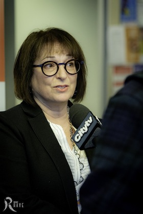 photo - Ivy Kopstein, coordinator of the substance use and addictions program at Jewish Child and Family Service of Winnipeg, answers a question from CityTV at the forum Wide Awake