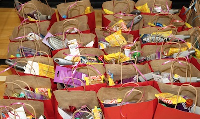 photo - Volunteers put together 1,200 care packages, which were distributed to those in need by various social services agencies and programs