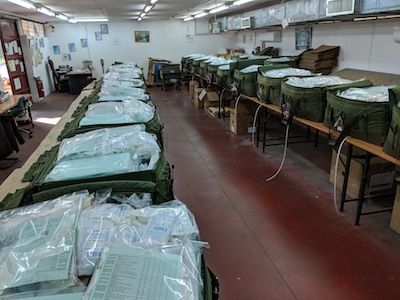 photo - Sar-El volunteers at a medical supply base near Tel Aviv make up medical kits