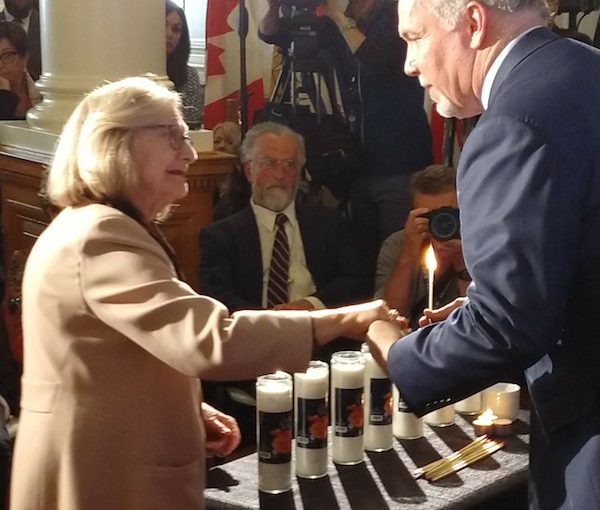 photo - Holocaust survivor Rita Akselrod and Premier John Horgan at the Yom Hashoah commemoration that took place at the British Columbia legislature May 2