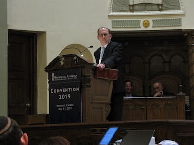 photo - Congregation Beth Israel Senior Rabbi Jonathan Infeld speaks about BI Rabbi Emeritus Wilfred Solomon at the Rabbinical Assembly in Montreal on May 5-8