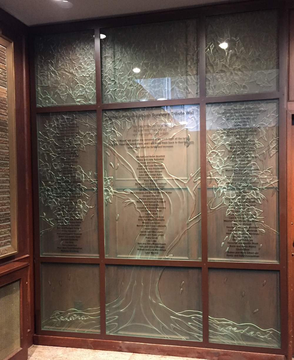 photo - The Schara Tzedeck Shoah Survivors Tribute Wall was created for the congregation by John Nutter. The sculpture, which includes the names of 230 survivors, was dedicated May 3