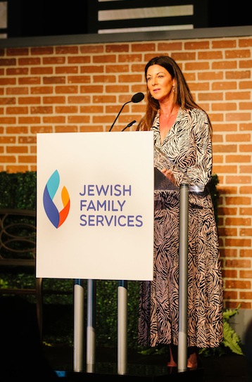 photo - JFS board member Jody Dales spoke about her own family’s struggles