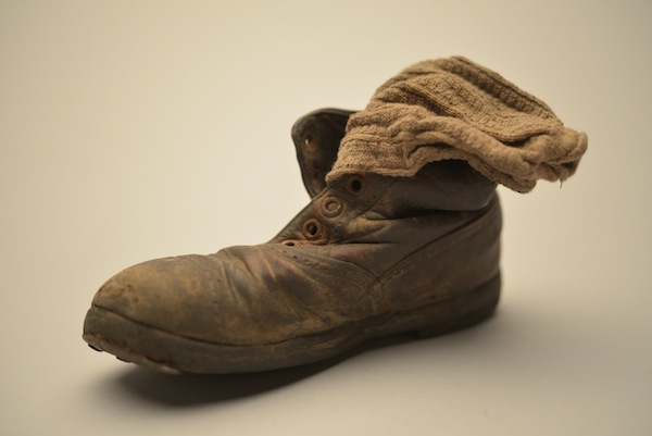 photo - This child’s shoe and sock were found in January 1945 among thousands of others at Auschwitz-Birkenau, abandoned by the Nazis as the Red Army approached