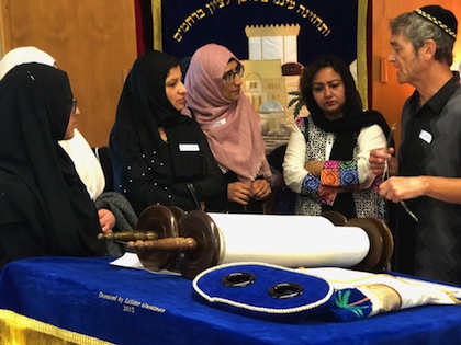 photo - Members of the Muslim community in Kelowna listen to Evan Orloff explain the Torah