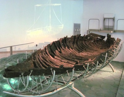 photo - The Sea of Galilee Boat or “Jesus Boat” on a metal frame in the Yigal Allon Museum in Kibbutz Ginosar, Tiberias, Israel