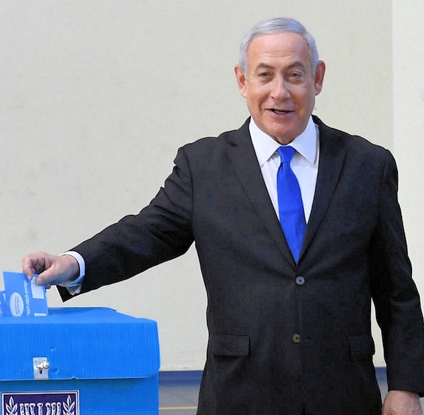 photo - Israeli Prime Minister Binyamin Netanyahu places his vote on election day