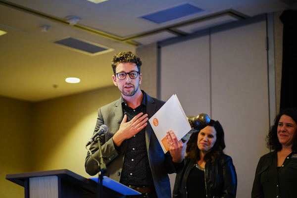 photo - Michael Schwartz of the Jewish Museum and Archives of British Columbia accepts the Award of Merit: Excellence in Community Engagement on behalf of all the partner organizations in the Cross Cultural Strathcona Walking Tour