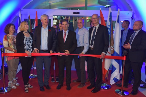 photo - Laureen and Stephen Harper, centre left, and Daniel Atar, KKL-JNF world chair, centre, were among those who cut the ribbon at the Nov. 6 official opening of the Stephen J. Harper Hula Valley Bird Sanctuary Visitor and Education Centre