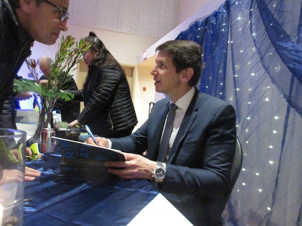 photo - Ronen Bergman signs a copy of his book Rise and Kill First: The Secret History of Israel’s Targeted Assassinations for an attendee of his talk at Congregation Beth Tikvah Feb. 2