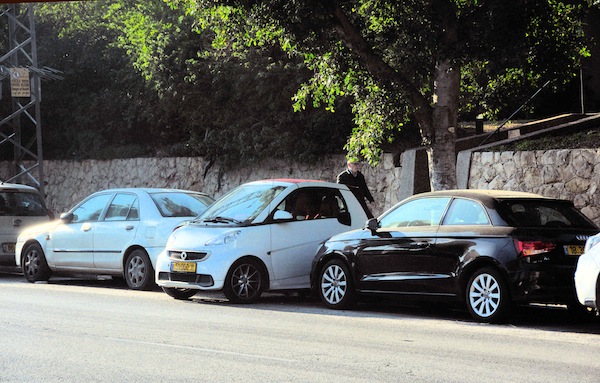 photo - In central Tel Aviv, a driver slotted their car in between two properly parked vehicles