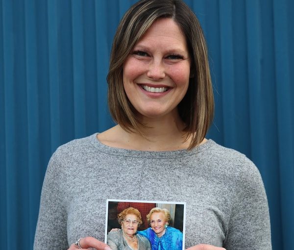 photo - Courtney Cohen holds a photo of her grandmothers, Rose Lewin, left, and Babs Cohen