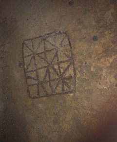 photo - In the Roman Plaza, a Roman soldiers’ game can be found on the ground