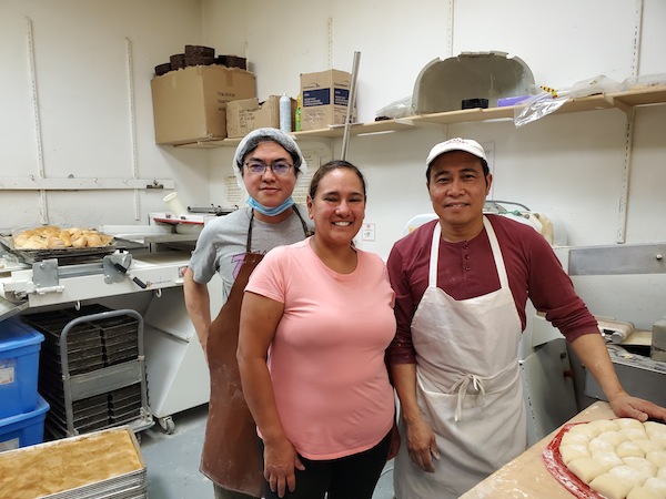 photo - Garden City Bakery owner Steve Uy, right, with store manager Monica Flores and fellow baker Richard Caranto