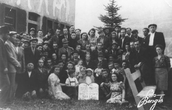 photo - A photo taken at a displaced persons camp in Germany, 1947. The author and her older brother, Hy, are in the centre, with their arms draped over each other