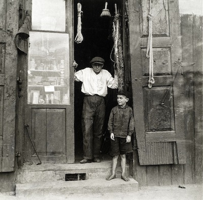 photo - Tim Gidal’s cousin Gershon in the doorway of the family’s rope shop, in Lowicz, Poland. The photo was taken by Gidal in 1932
