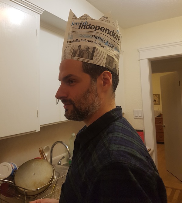 photo - Aaron Dewitt put the Feb. 12 issue of the Jewish Independent to good use on Purim – after reading it from cover to cover, we trust