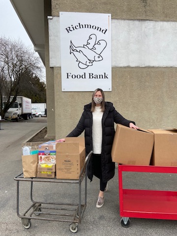 photo - Courtney Cohen outside the Richmond Food Bank, delivering donations