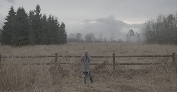 image - A still from the documentary Crackin’ Out: The Ronnie Tessler Rodeo Collection, showing photographer Ronnie Tessler. The documentary was directed by Sarah Genge and produced by the Jewish Museum and Archives of British Columbia