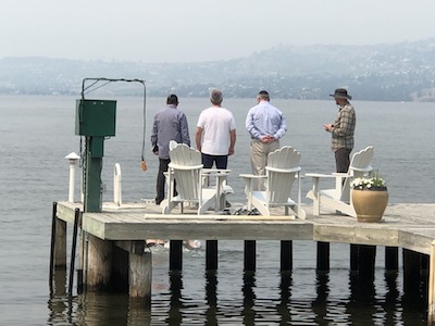 photo - The rabbis supervise the mikvah ceremony on Lake Okanagan