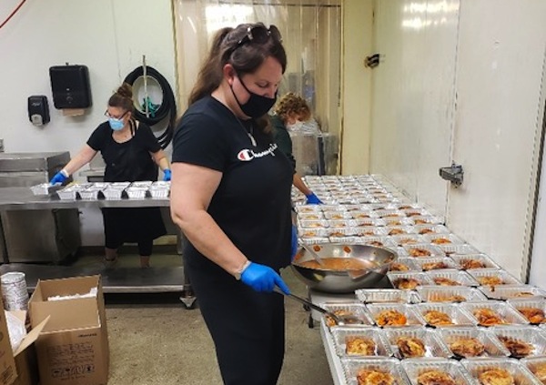 photo - Light of Shabbat Volunteers packaging kosher meals for the High Holidays