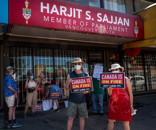 photo - Or Shalom members Lorne Malliin and Marianne Rev organized a demonstration at the office of Harjit Sajjan, federal minister of national defence and MP for Vancouver South