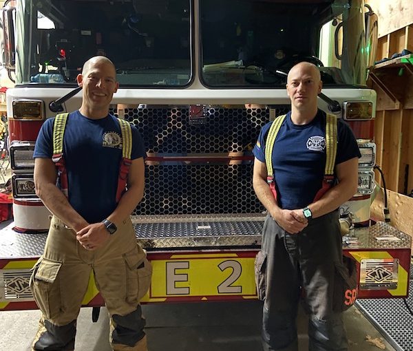 photo - Firefighters Daniel Greenberg, left, and Adam Bender