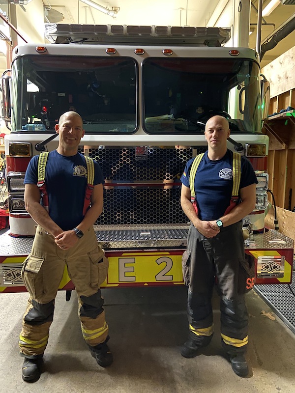 photo - Firefighters Daniel Greenberg, left, and Adam Bender