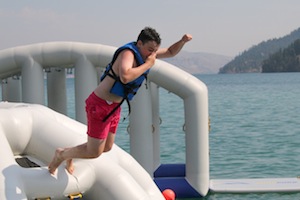 photo - Camper jumps into the water