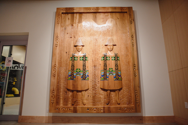 photo - The museum’s lobby features a cedar carving of Sch’ich’iyuy (the Two Sisters) by Squamish carver Wade Baker
