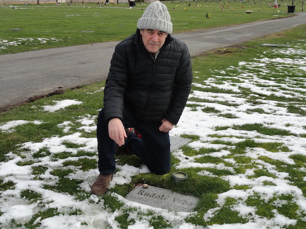 photo - Alan Twigg, author of Out of Hiding: Holocaust Literature of British Columbia, at the gravesite of Rudolf “Rudi” Vrba, who died in 2006