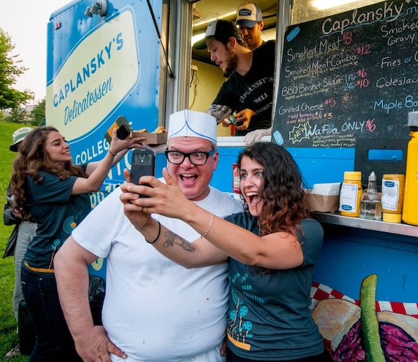 photo - A Caplansky’s Deli fan takes a selfie with the restaurant’s founder, Zane Caplansky