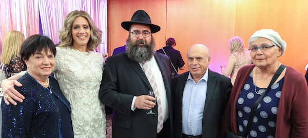 photo - At the Freilach 25 gala on June 19, left to right, are Yocheved Baitelman, Chanie Baitelman, Rabbi Yechiel Baitelman, Natan Sharansky and Avital Sharansky