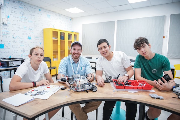 photo - ORT delegate Nata Saslofsky with students from the D. Dan and Betty Kahn STEAM Centre at the Rodman Middle School in Kiryat Yam, Israel
