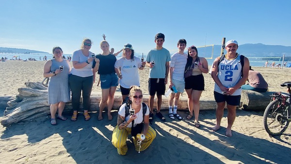 photo - Mahla Finkleman, Canadian national manager of partnership and outreach for Masa Israel Journey (standing, fourth from the left), at Kits Beach in July with participants of the Shalom U’Lhitraot event