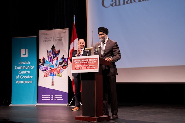 photo - Minister and MP Harjit Sajjan speaks at the Jewish Community Centre of Greater Vancouver on Dec. 5, while Jewish Federation chief executive officer Ezra Shanken looks on