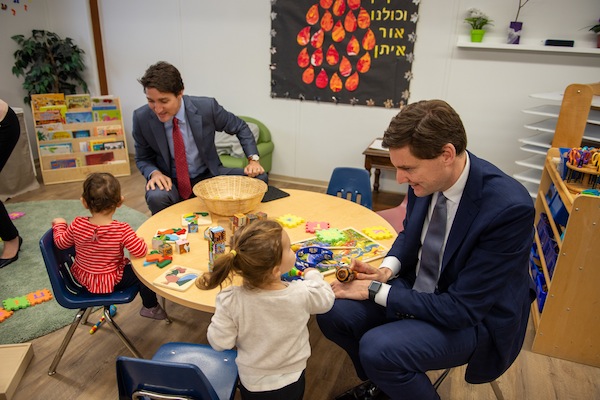photo - Prime Minister Justin Trudeau and B.C. Premier David Eby interact with kids at Richmond Jewish Day School on Dec. 2