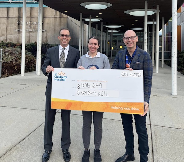 photo - Shay Keil and his daughter Tali Keil presented a $106,649 cheque to B.C. Children’s Hospital Foundation chief executive officer Malcolm Berry in late October