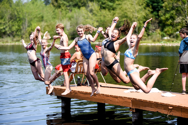 photo - kids jumping off a dock at Camp Solomon Schechter